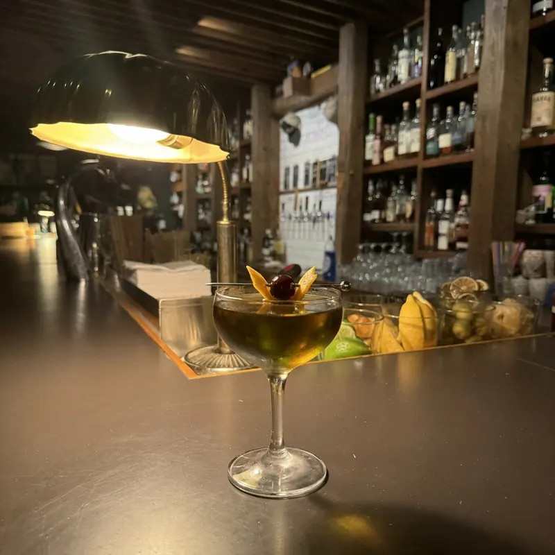 The Bijou cocktail, dim candlelight at Robin Room.