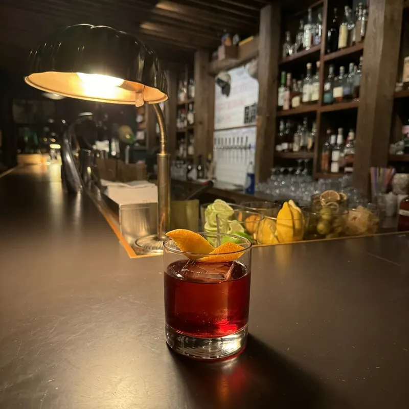 The Boulevardier cocktail, dim candlelight at Robin Room.