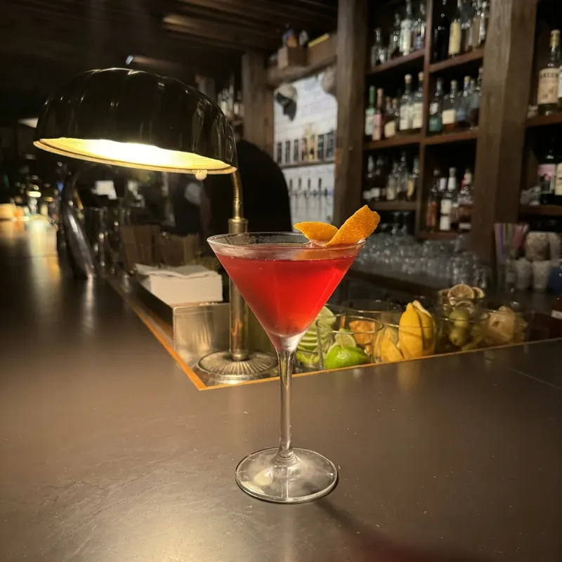 The Cosmopolitan cocktail, dim candlelight at Robin Room.