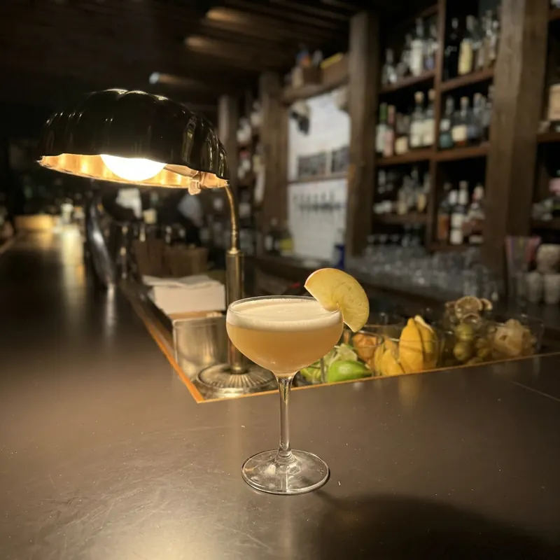 The Farmhouse cocktail, dim candlelight at Robin Room.