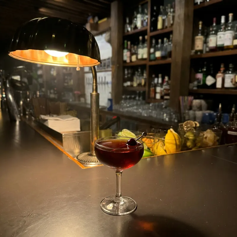 The House Manhattan cocktail, dim candlelight at Robin Room.