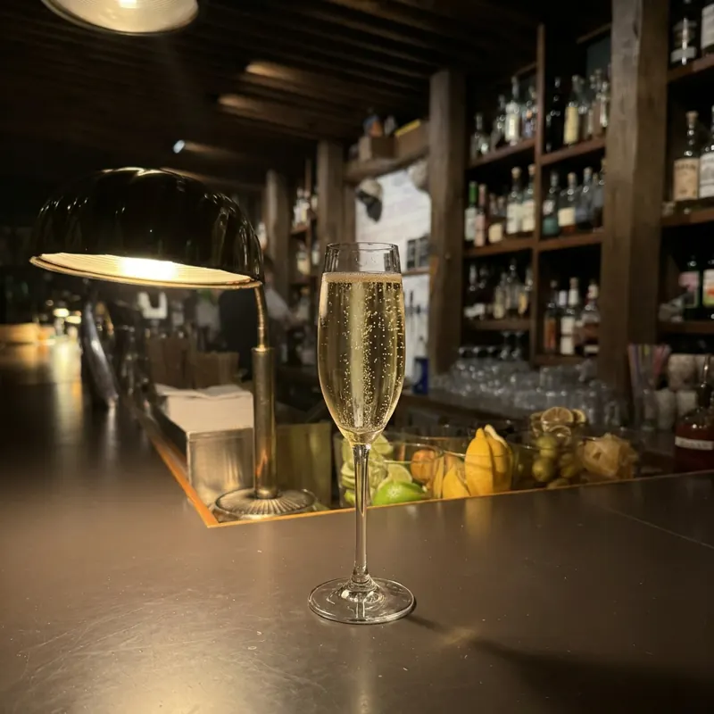 The Los Monteros Brut Cava cocktail, dim candlelight at Robin Room.