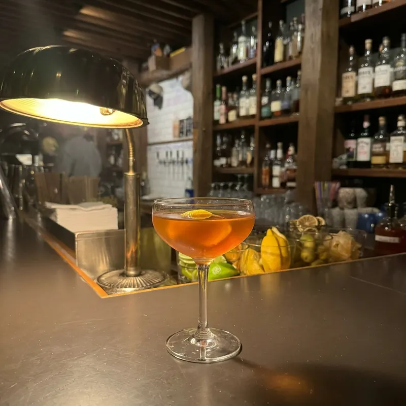 The Paper Plane cocktail, dim candlelight at Robin Room.