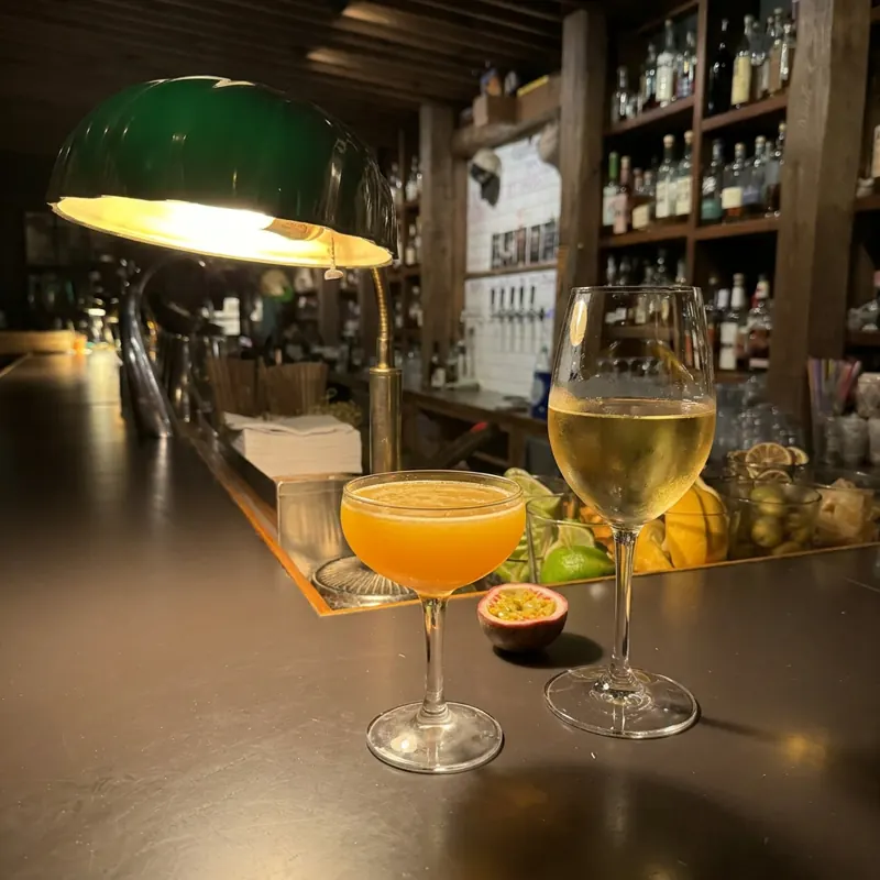 The Passionfruit Boilermaker cocktail, dim candlelight at Robin Room.