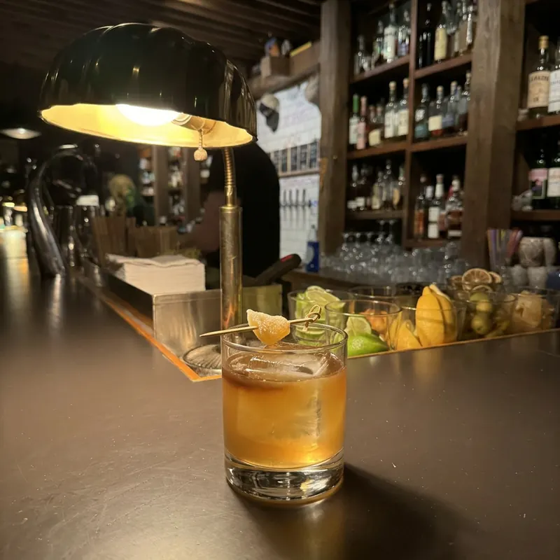 The Penicillin cocktail, dim candlelight at Robin Room.