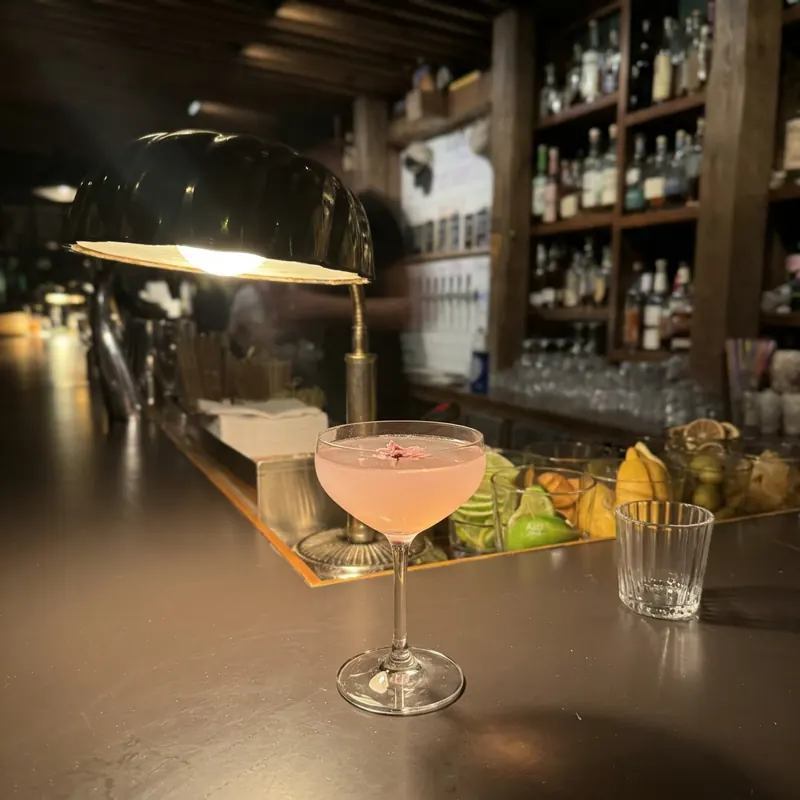 The Sakura Blossom cocktail, dim candlelight at Robin Room.
